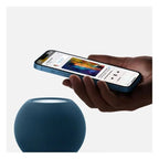 Blue Apple HomePod mini smart speaker by Oraxxi, showing the compact device with touch controls and sleek design.