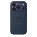 Orange silicone case with MagSafe attached to a midnight iPhone 17 Pro, showing a close-up of the protective cover.