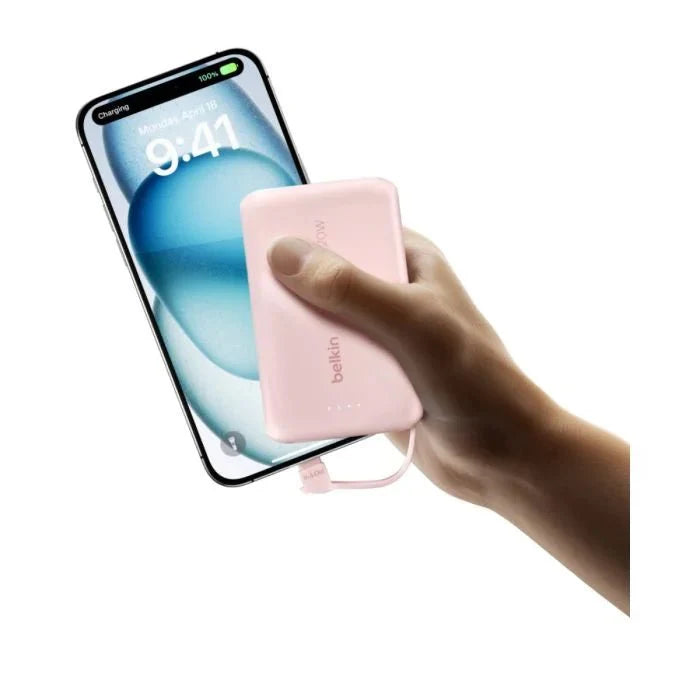 Pink Belkin 10,000mAh 20W power bank with USB-C port and integrated cable, designed for portable device charging.
