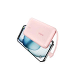 Pink Belkin 10,000 mAh 20W power bank with USB-C port and integrated cable, featuring a compact design and digital display.