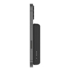 Black Belkin 5K Magnetic Wireless Power Bank with 5000mAh capacity and kickstand, designed for convenient mobile charging.