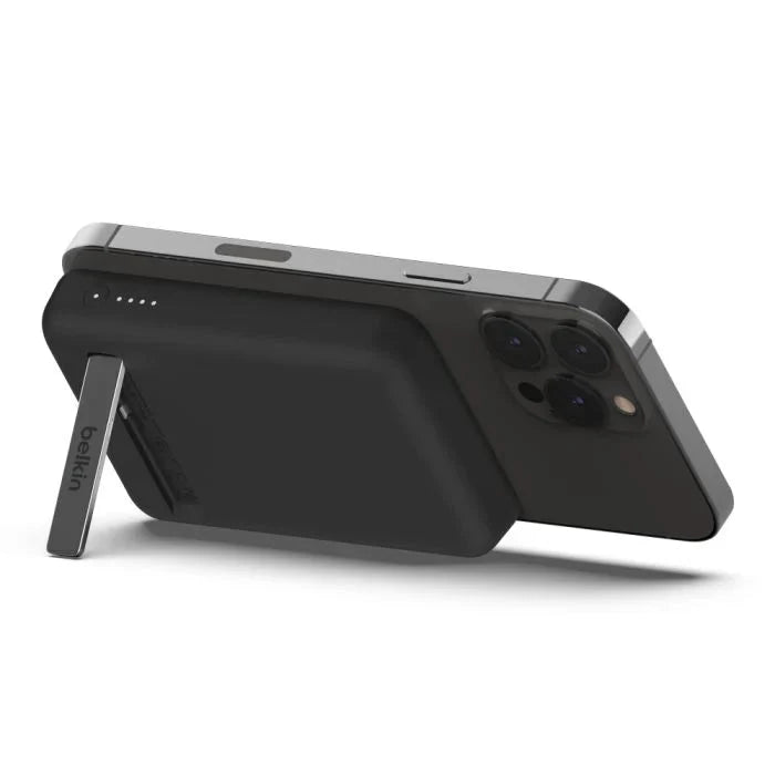 Black Belkin 5K Magnetic Wireless Power Bank with 5000mAh capacity and built-in kickstand by Oraxxi.