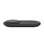 Black Belkin BoostCharge Pro 2-in-1 wireless charger on a sleek surface, designed for fast charging smartphones and earbuds.